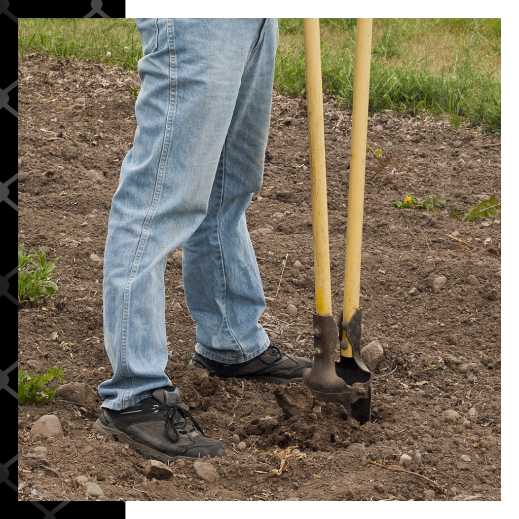 man digging hole in dirt