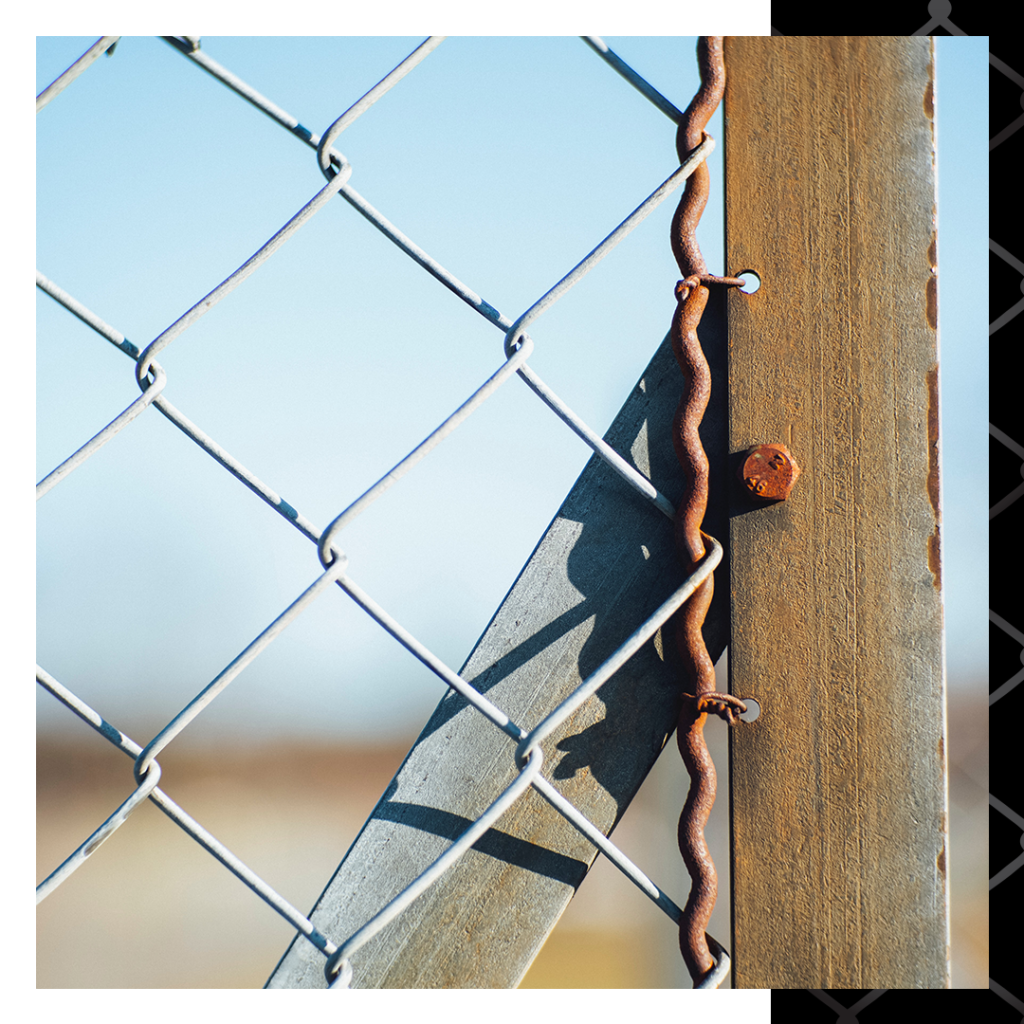 close up of rust on a chain link fence