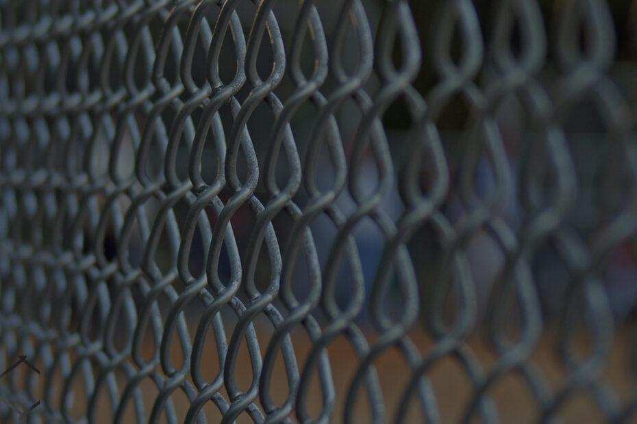 photo of chain link fence with blurred depth of field